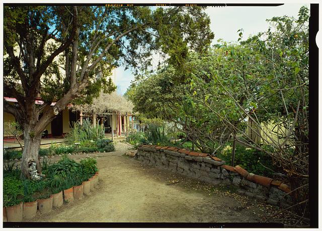 View of east garden with original adobe retaining wall from south-east (duplicate of CA-1501-20) - Zanetta House, San Juan Bautista State Historical Park, San Juan Bautista, San Benito County, CA